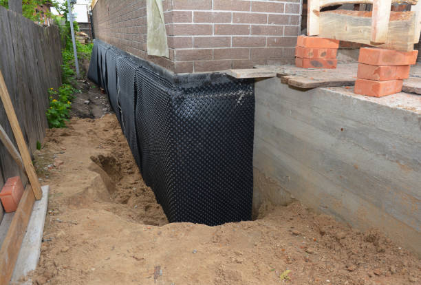 Happy homeowners after waterproofing job in Chanhassen